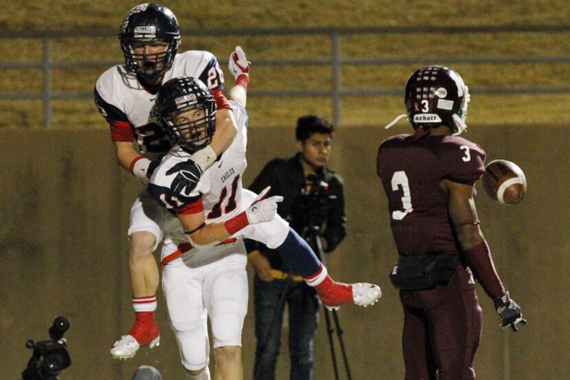 Allen High's Oliver Pierce (26) rides the back of receiver Cole Carter (11), as he tosses...