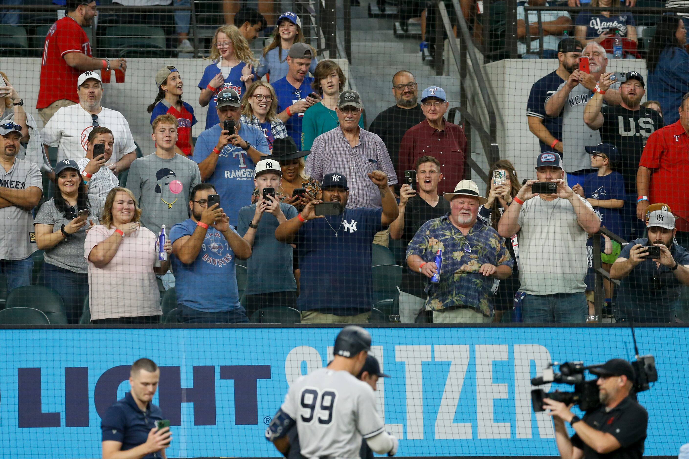 Fans cheer on New York Yankees right fielder Aaron Judge (99) after he hit his 62nd home run...