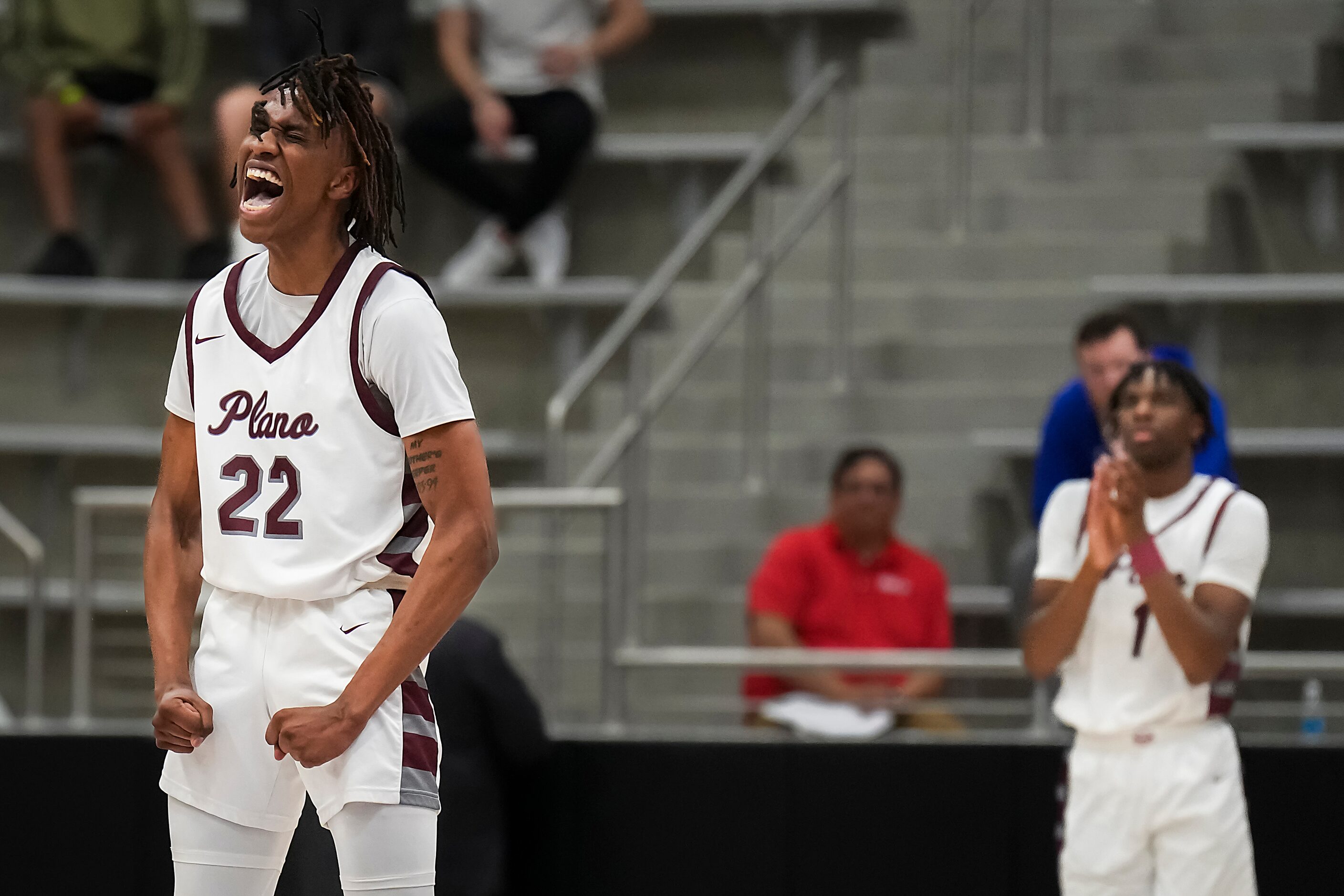 Plano forward Nikk Williams (22) celebrates after  a Denton Guyer turnover during the second...