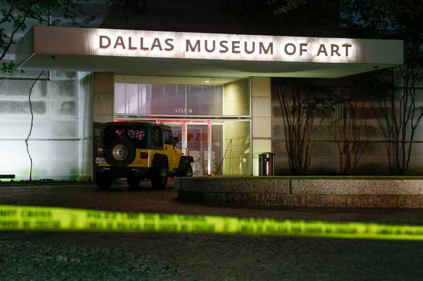 Police tape blocks an entrance to the Dallas Museum of Art entrance at Flora and Harwood...