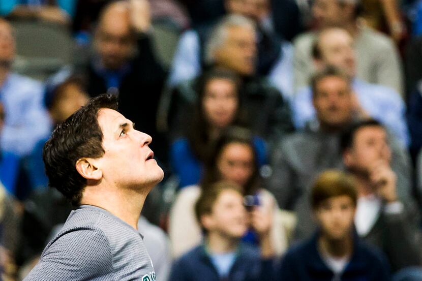 Dallas Mavericks owner Mark Cuban looks up at the scoreboard during the second half of an...