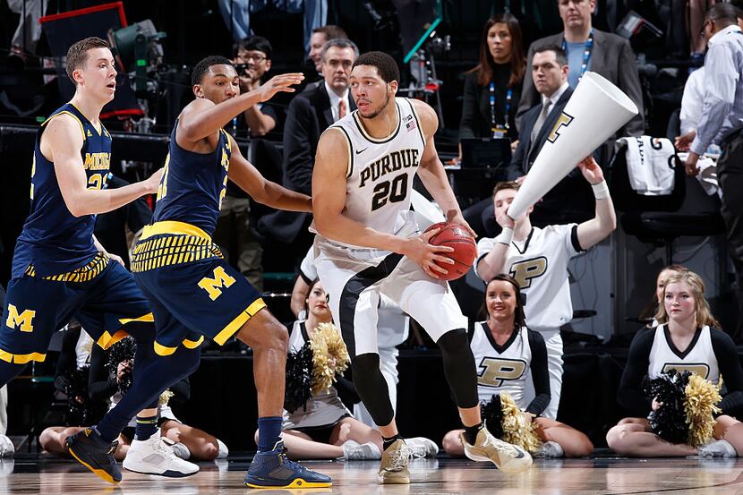 INDIANAPOLIS, IN - MARCH 12: A.J. Hammons #20 of the Purdue Boilermakers looks to the basket...