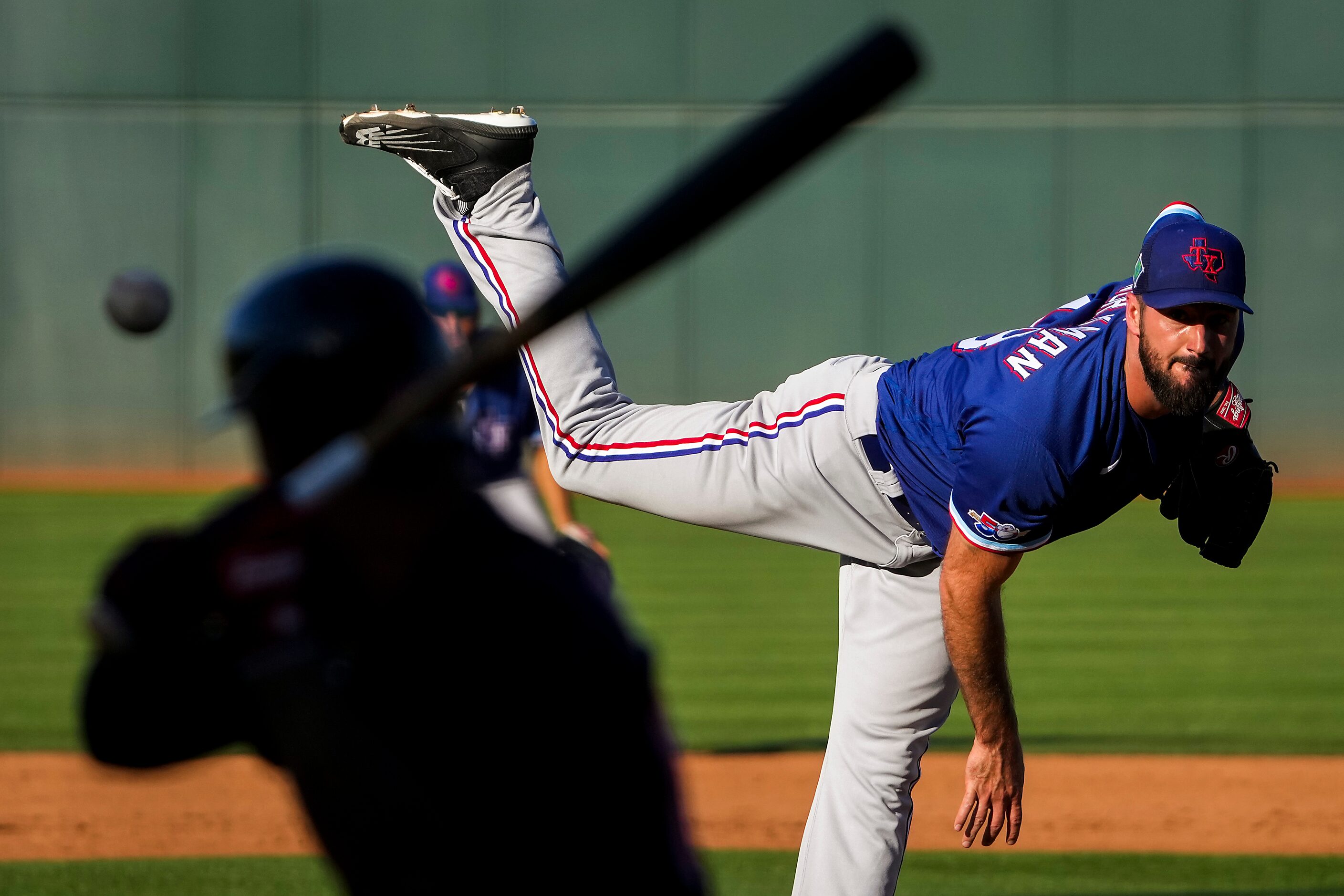 Texas Rangers pitcher Brandon Workman delivers during the eighth inning of a spring training...