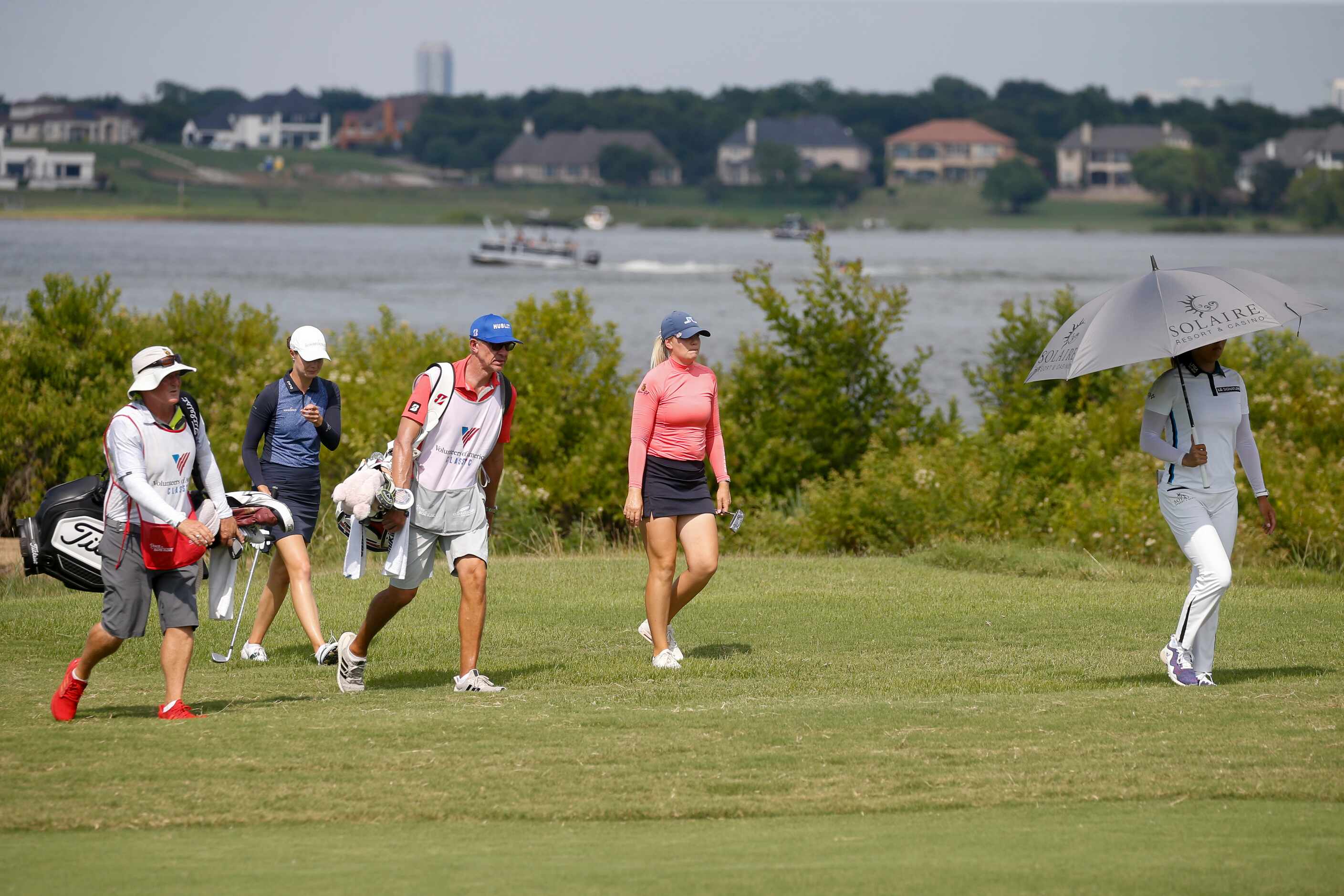 The final grouping makes their way down the No. 5 fairway during the final round of the LPGA...