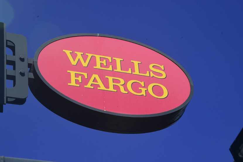 A Wells Fargo sign is seen in front of a branch in Pasadena, Cali. Wells Fargo agreed to a...