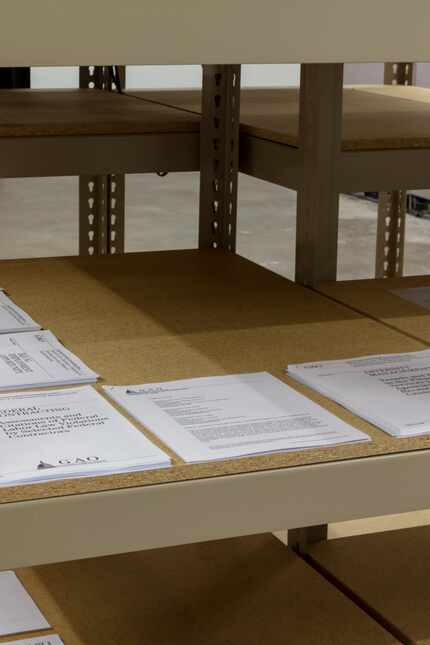 Printouts of various U.S. government reports are included in the exhibition.