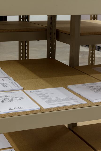 Printouts of various U.S. government reports are included in the exhibition.