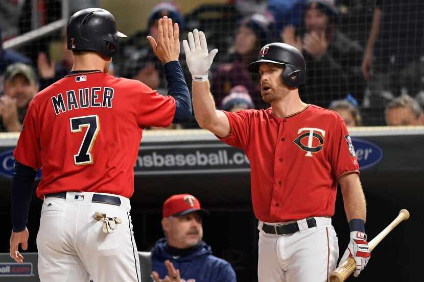 MINNEAPOLIS, MN - SEPTEMBER 28: Logan Forsythe #24 of the Minnesota Twins congratulates...