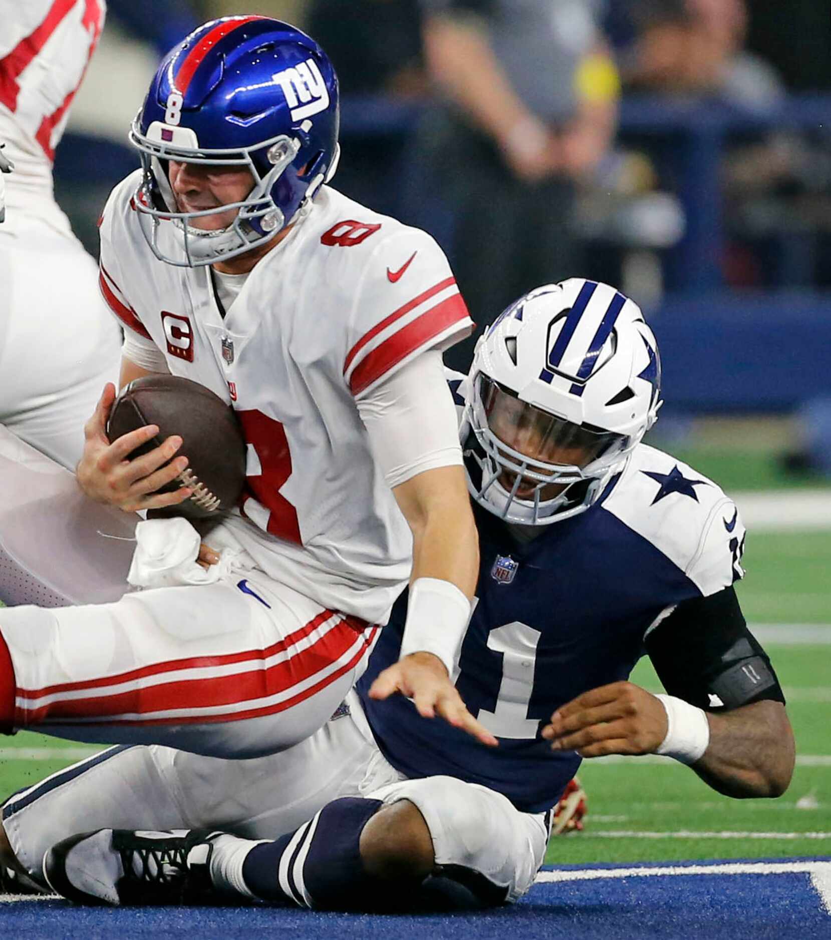 New York Giants quarterback Daniel Jones (8) is sacked by Dallas Cowboys linebacker Micah...