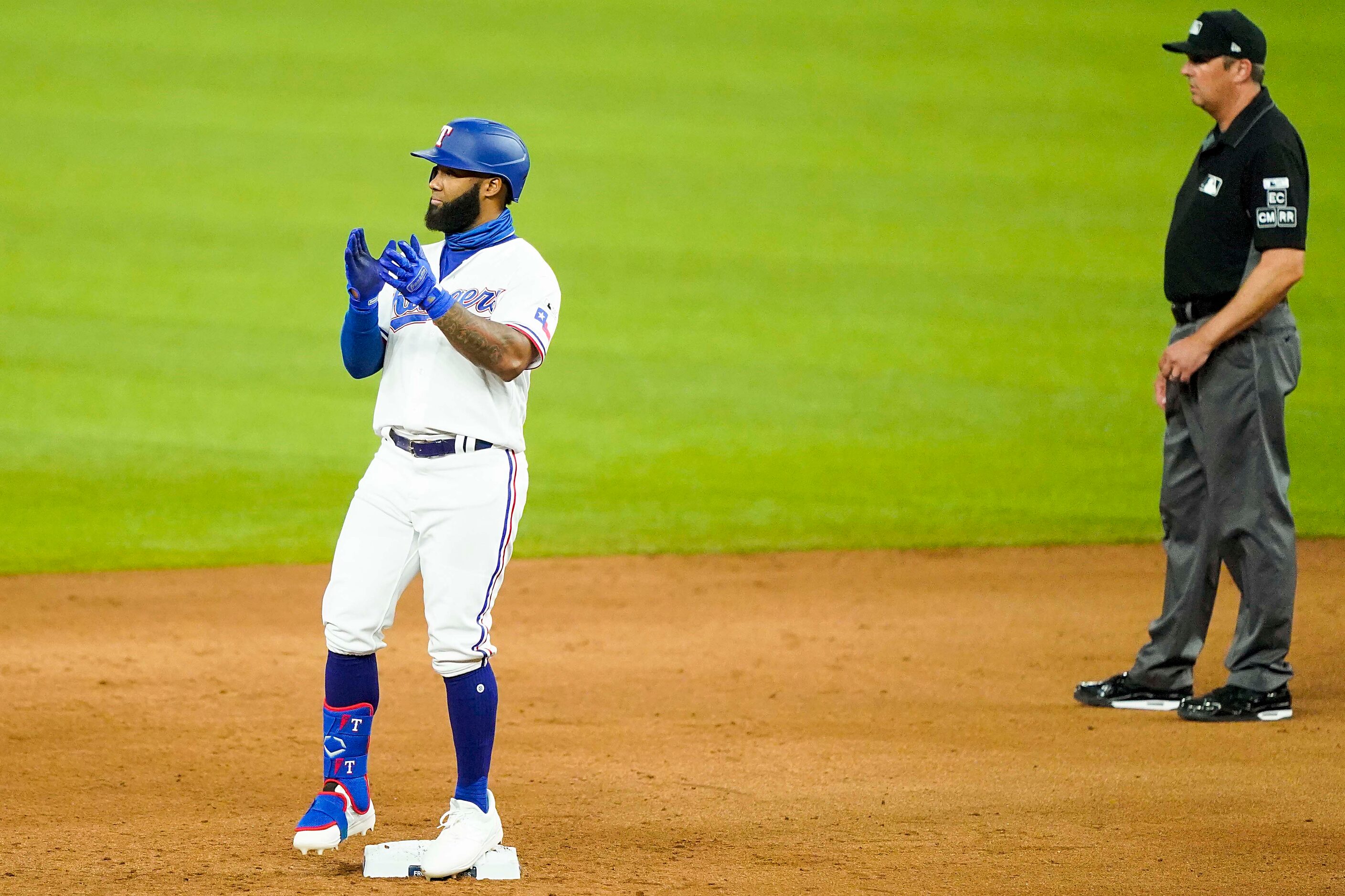 Texas Rangers outfielder Danny Santana celebrates after hitting a double, the first Rangers...