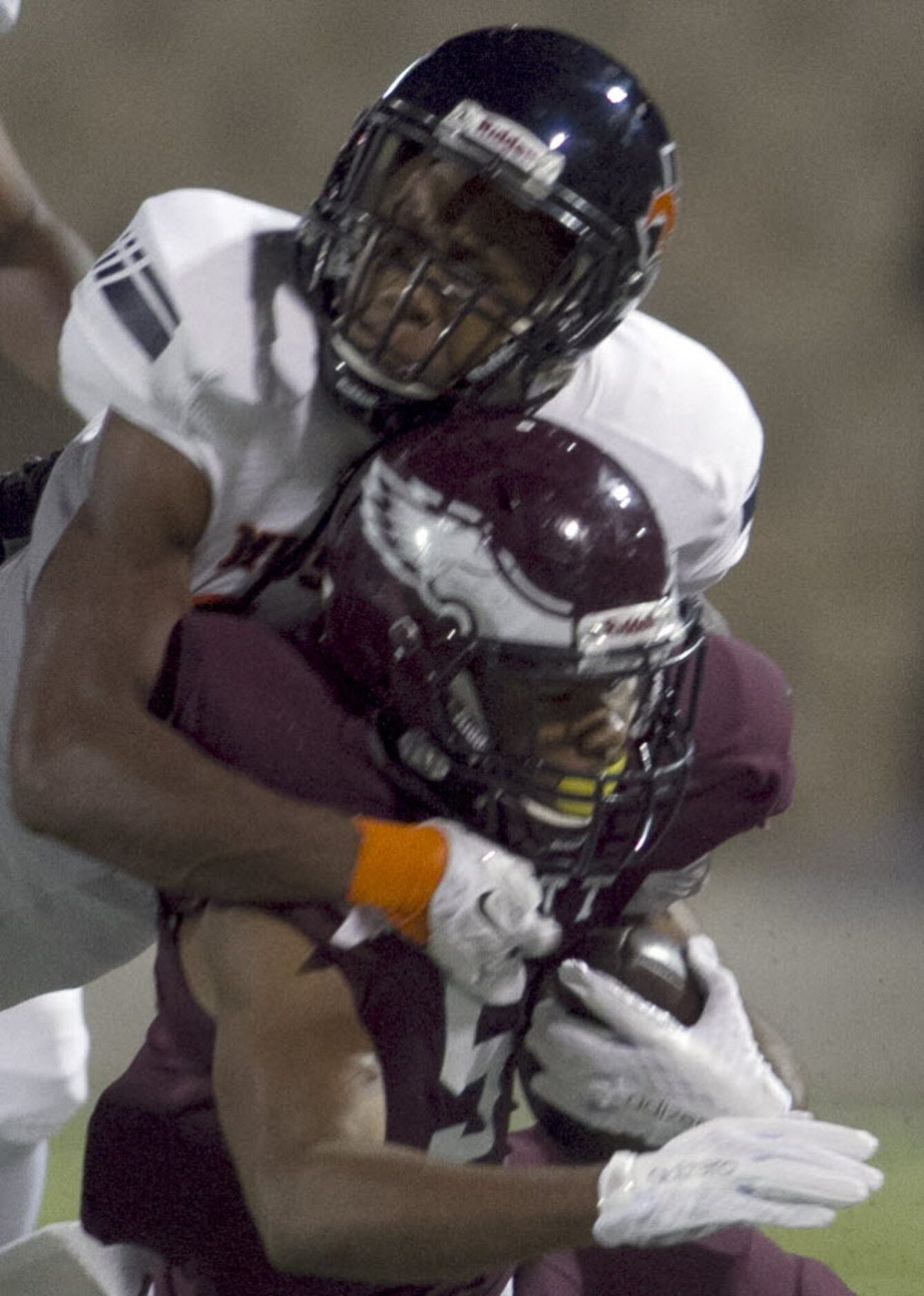 Rowlett running back Kobe Morrow (5) is brought down by a flying tackle applied by Sachse...