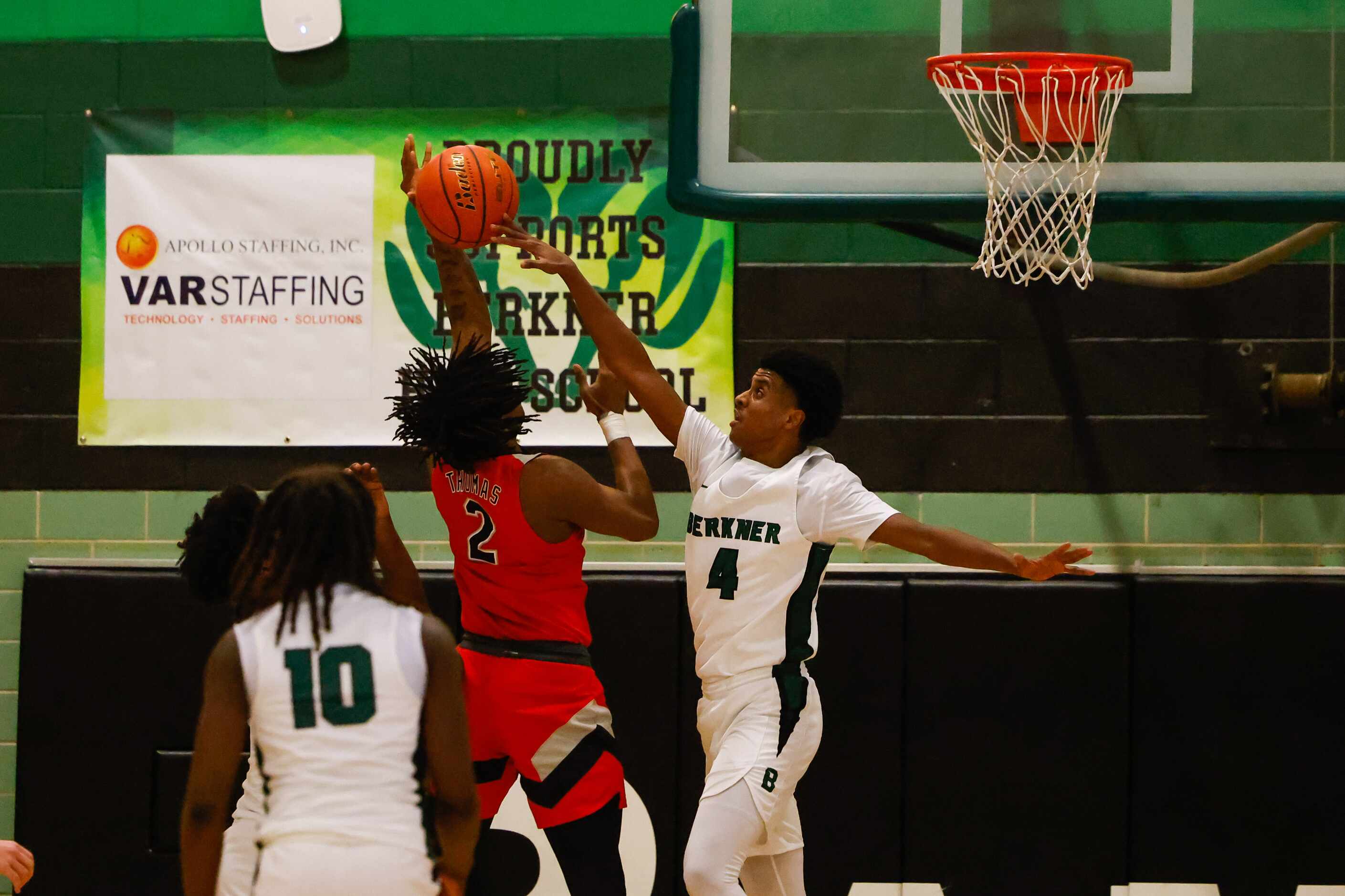 Berkner High School' Adonai Rezene #4 blocks a shot by Lake Highlands High School' Khaleel...