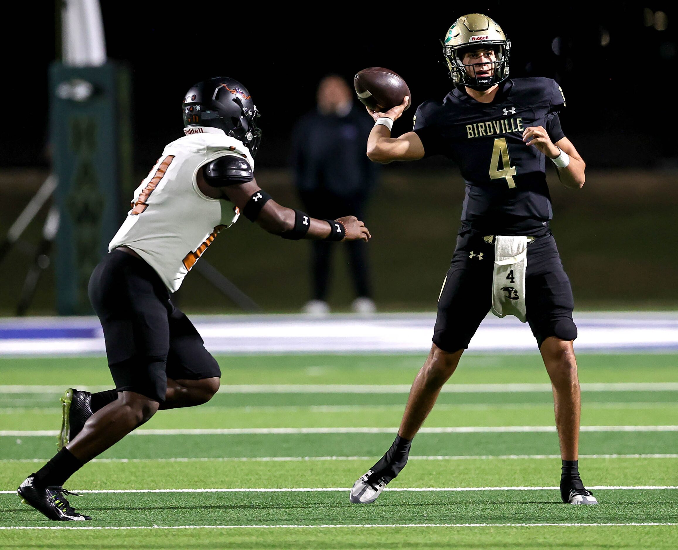 Birdville quarterback Noah Normand (4) gets pressured by W.T. White linebacker Markavious...