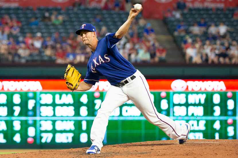 Texas Rangers starting pitcher Mike Minor pitches during the seventh inning against the San...