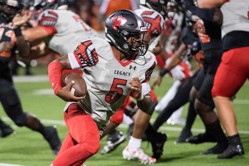 Mansfield Legacy quarterback/safety Jalen Catalon turns the ball upfield against Lancaster...