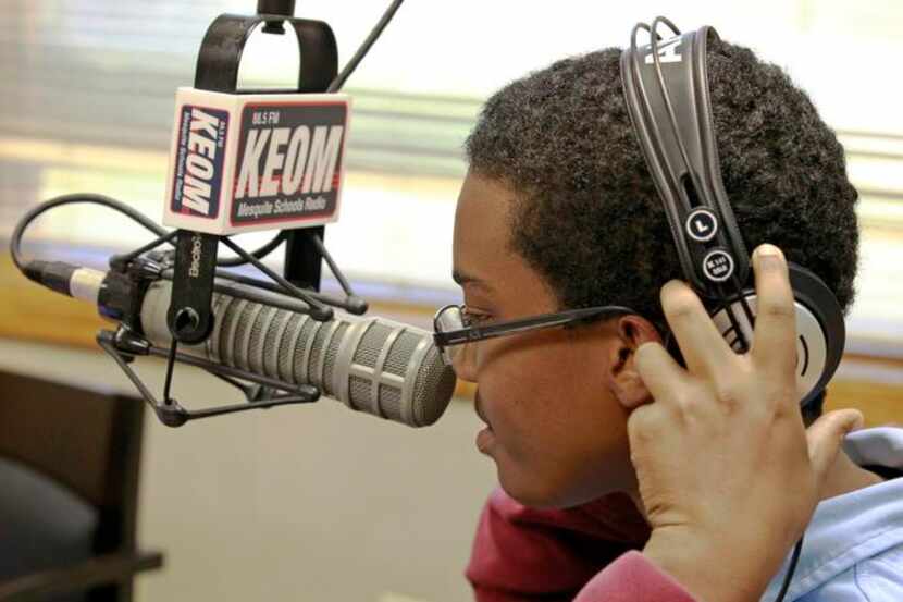 
Michael Holland, a 17-year-old student at West Mesquite High School, puts on his headphones...