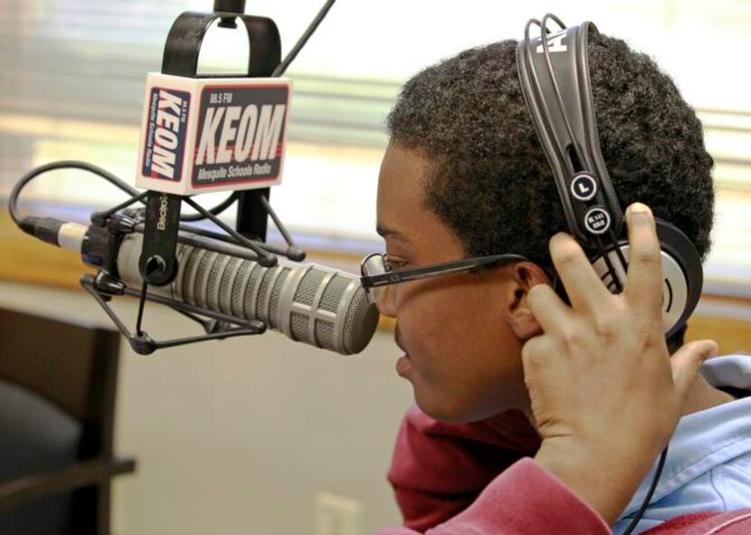 
Michael Holland, a 17-year-old student at West Mesquite High School, puts on his headphones...