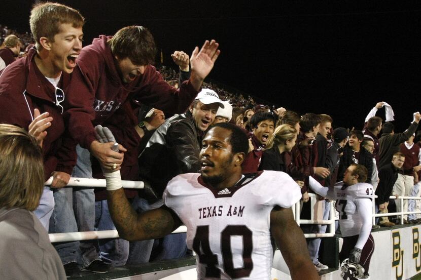 Texas AM Aggies defensive end Von Miller (40) celebrates their come from behind win over...