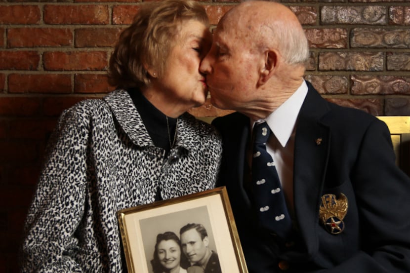 Eloise and Robert Hall, shown with their wedding photo from 1943, met at a USO dance and...