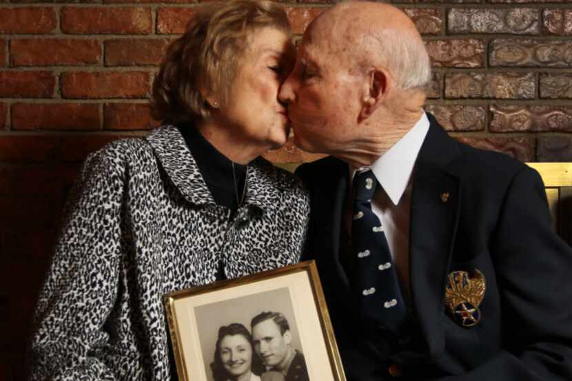 Eloise and Robert Hall, shown with their wedding photo from 1943, met at a USO dance and...