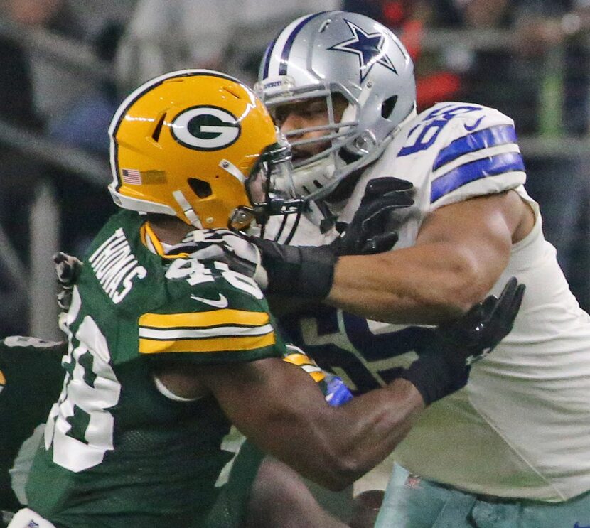 Dallas Cowboys guard Ronald Leary (65) blocks Green Bay Packers inside linebacker Joe Thomas...