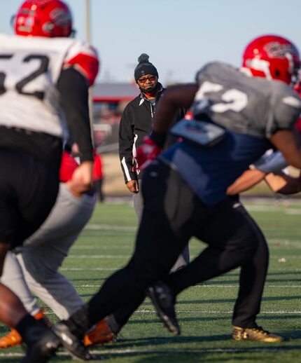 Cedar Hill coach Carlos Lynn watches his team practice at Longhorn Stadium in Cedar Hill on...