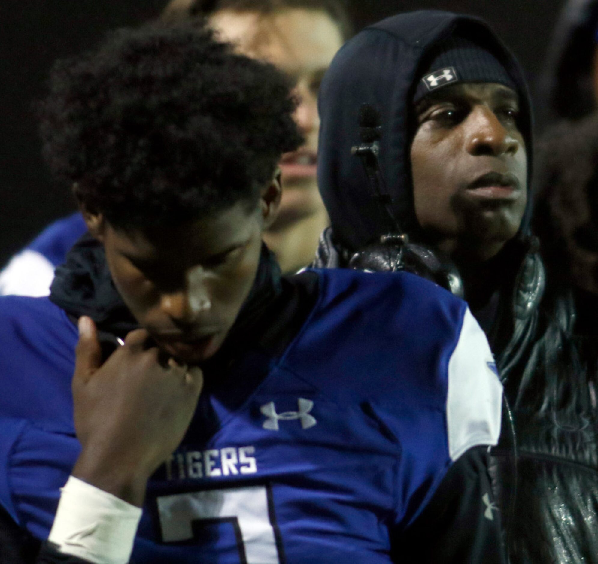 Trinity Christian-Cedar Hill quarterback Shedeur Sanders (2), left, along with his dad,...