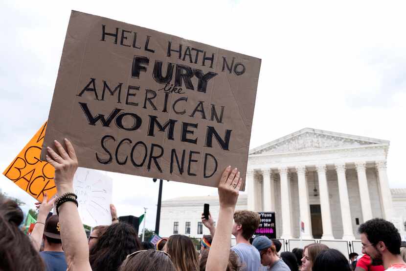 People protest following the Supreme Court's decision to overturn Roe v. Wade in Washington,...