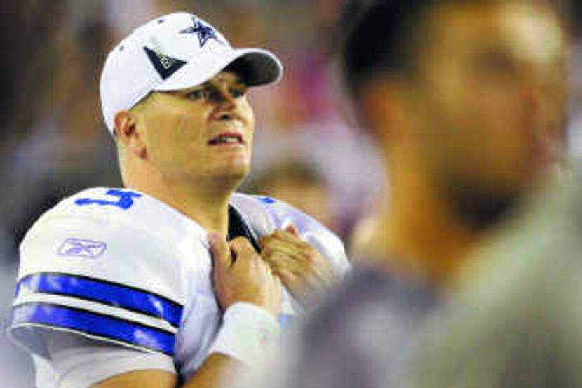  Quarterback Jon Kitna looks on after suffering a strained left oblique in the loss to...