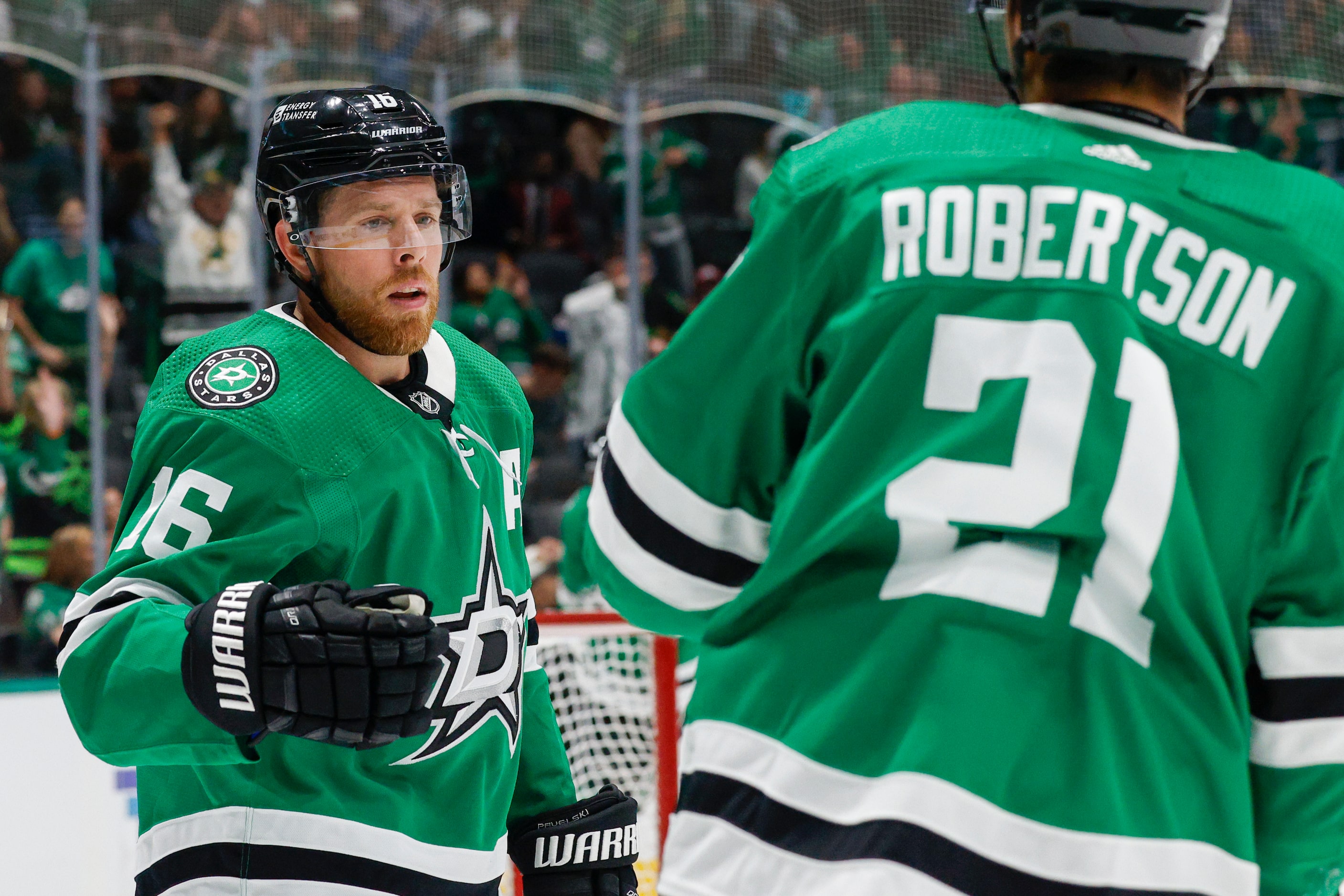 Dallas Stars center Joe Pavelski (16) celebrates his goal with left wing Jason Robertson...