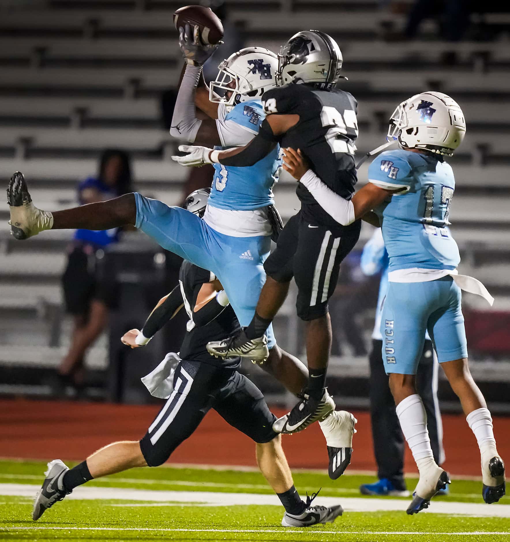 Wilmer-Hutchins wide receiver Jayvon Roe catches a pass as Panther Creek   defensive back...