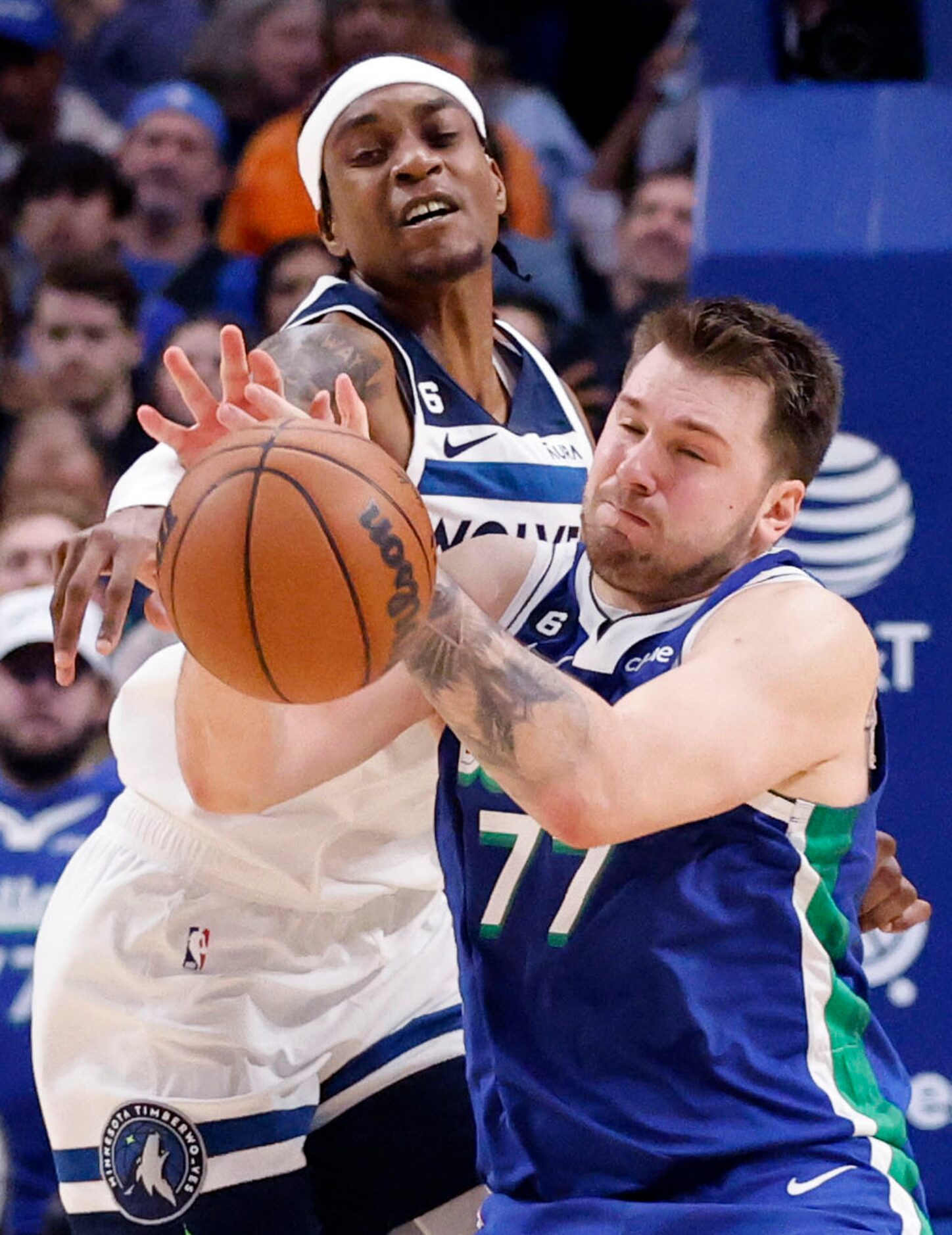 Dallas Mavericks guard Luka Doncic (77) has the ball knocked away from Minnesota...