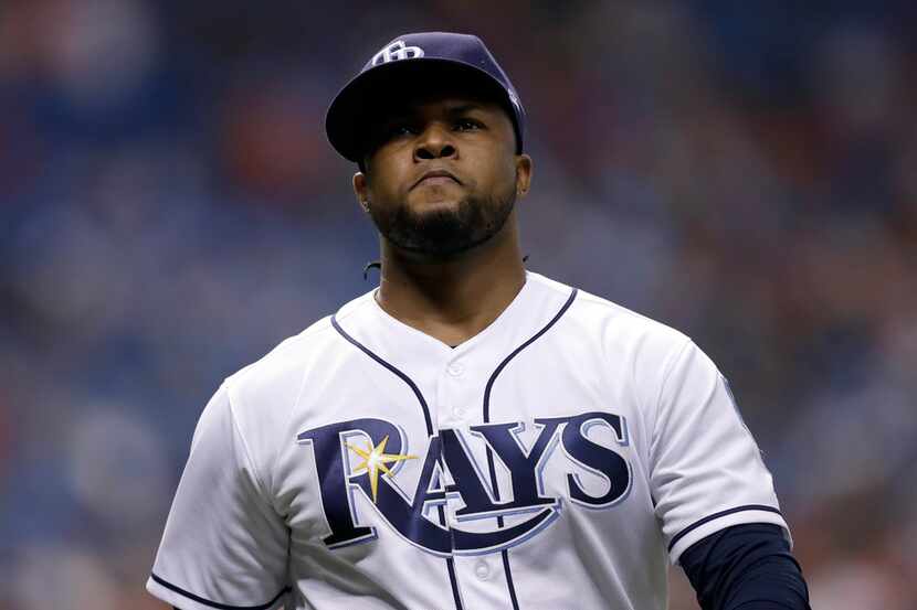 Tampa Bay Rays relief pitcher Alex Colome leaves the field after allowing the go-ahead run...