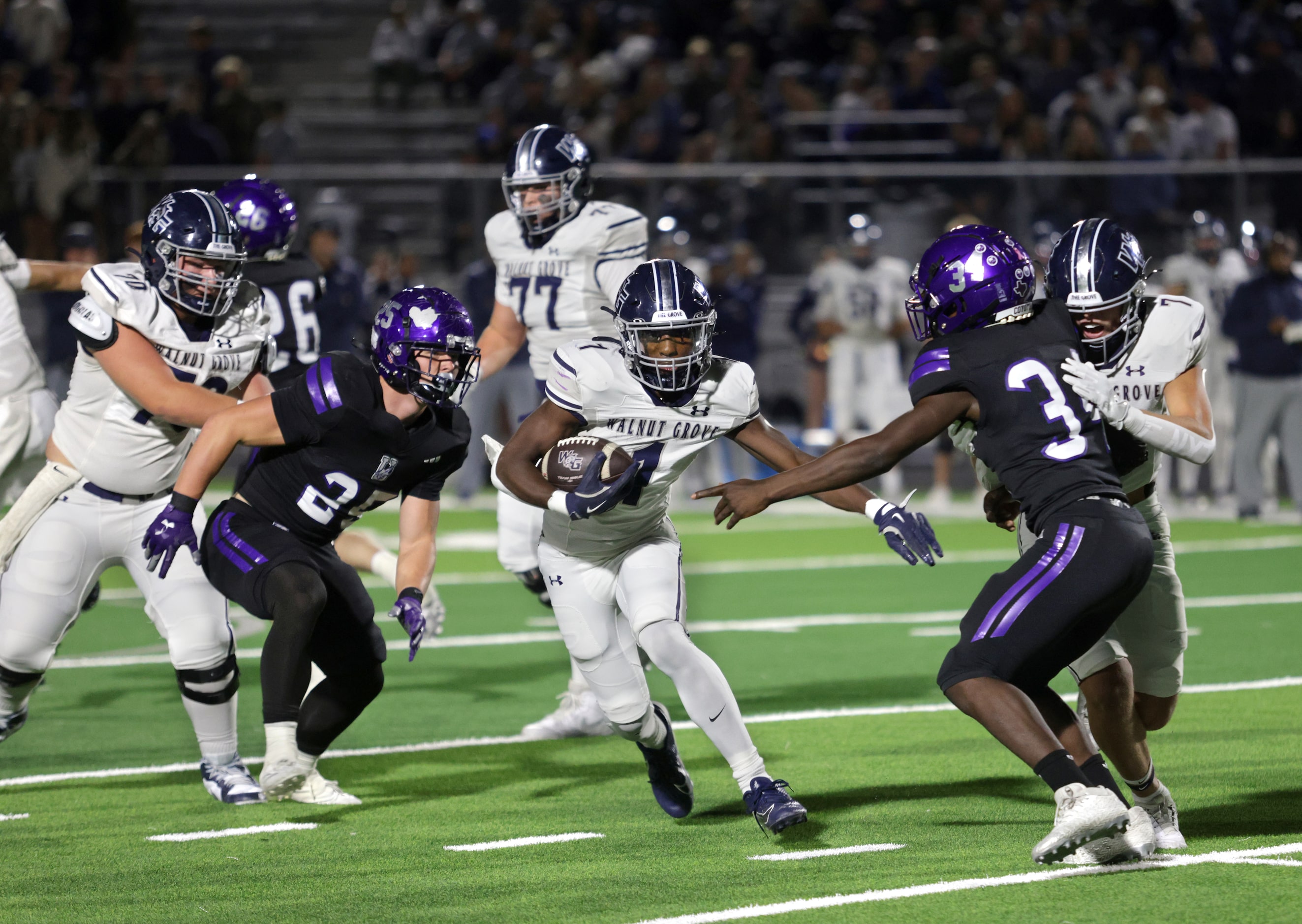 Walnut Grove player #1 Cam Newton slips through a hole for a gain during the Prosper Walnut...