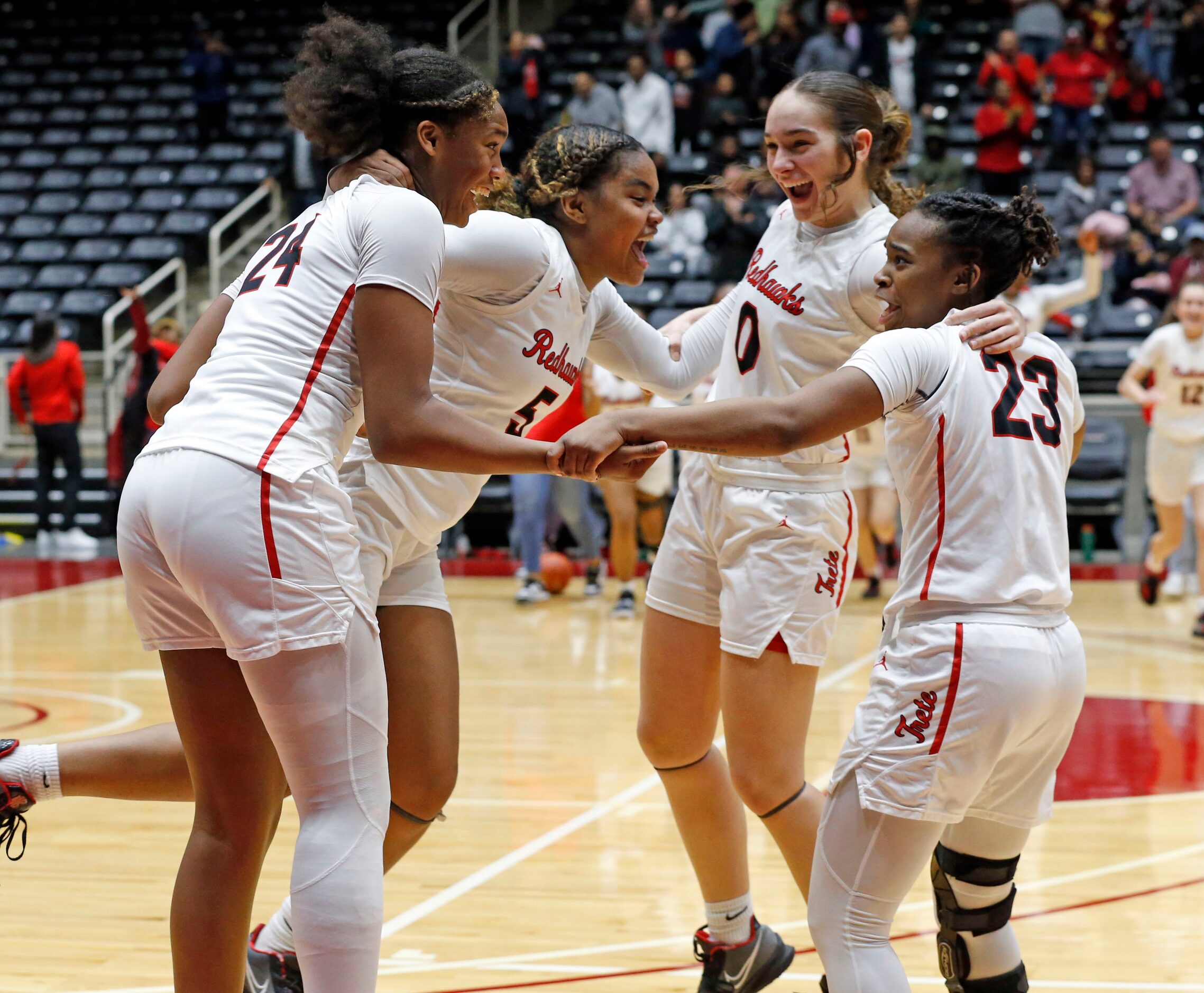 Frisco Liberty High’s Jacy Abii (24), Keyera Roseby (5),  Jezelle Jolie Moreno (0) and...