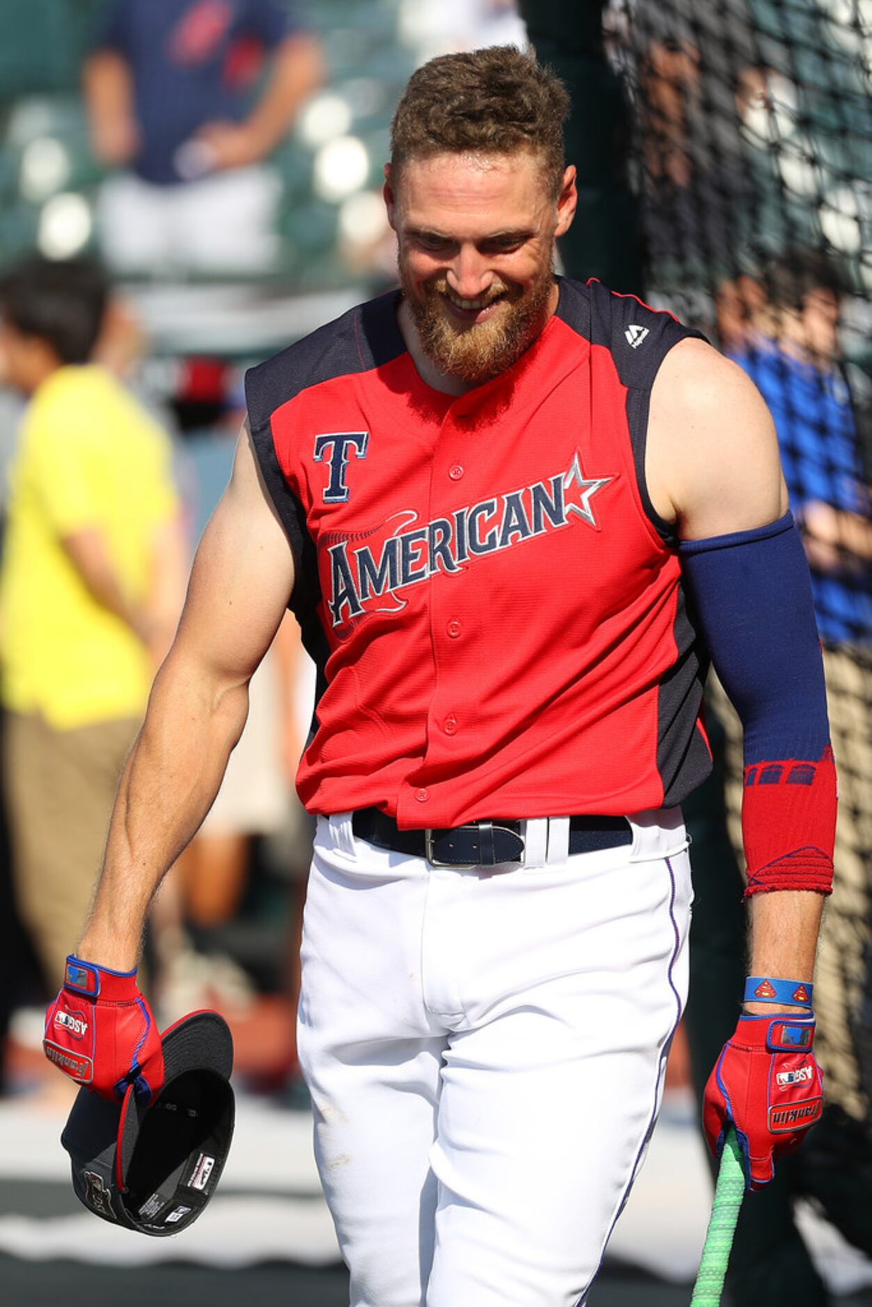 CLEVELAND, OHIO - JULY 09: Hunter Pence #24 of the Texas Rangers warms up prior to the 2019...