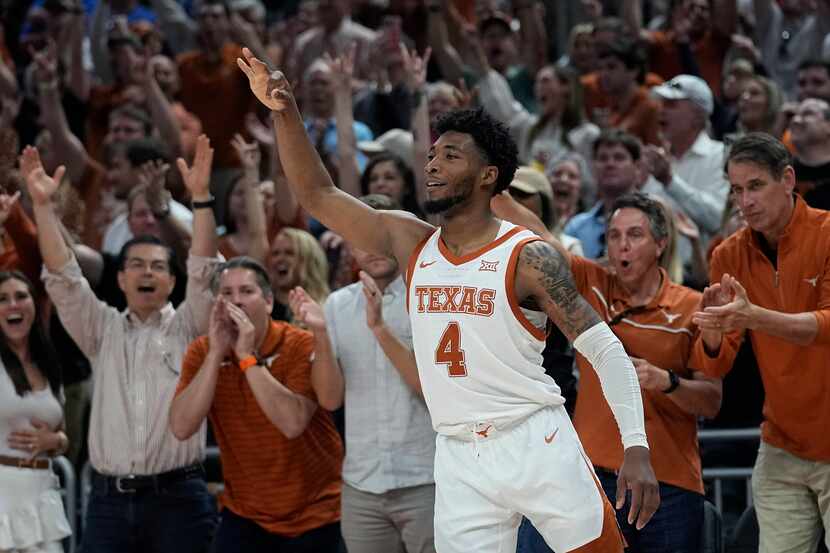 Texas guard Tyrese Hunter (4) celebrates a score against Kansas during the second half of an...