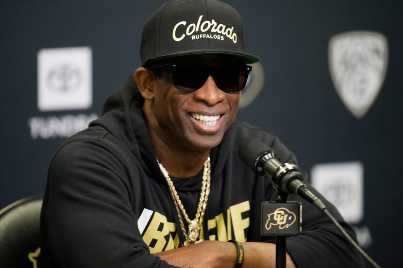 Colorado head coach Deion Sanders responds to questions during a news conference after the...