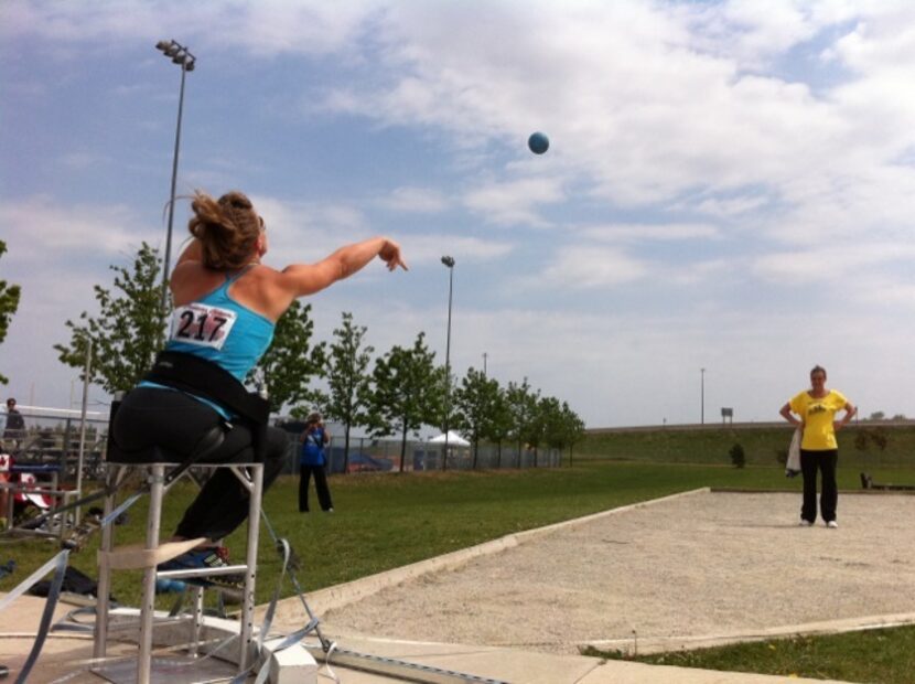 Amy Simmons follows through on a shot put throw.