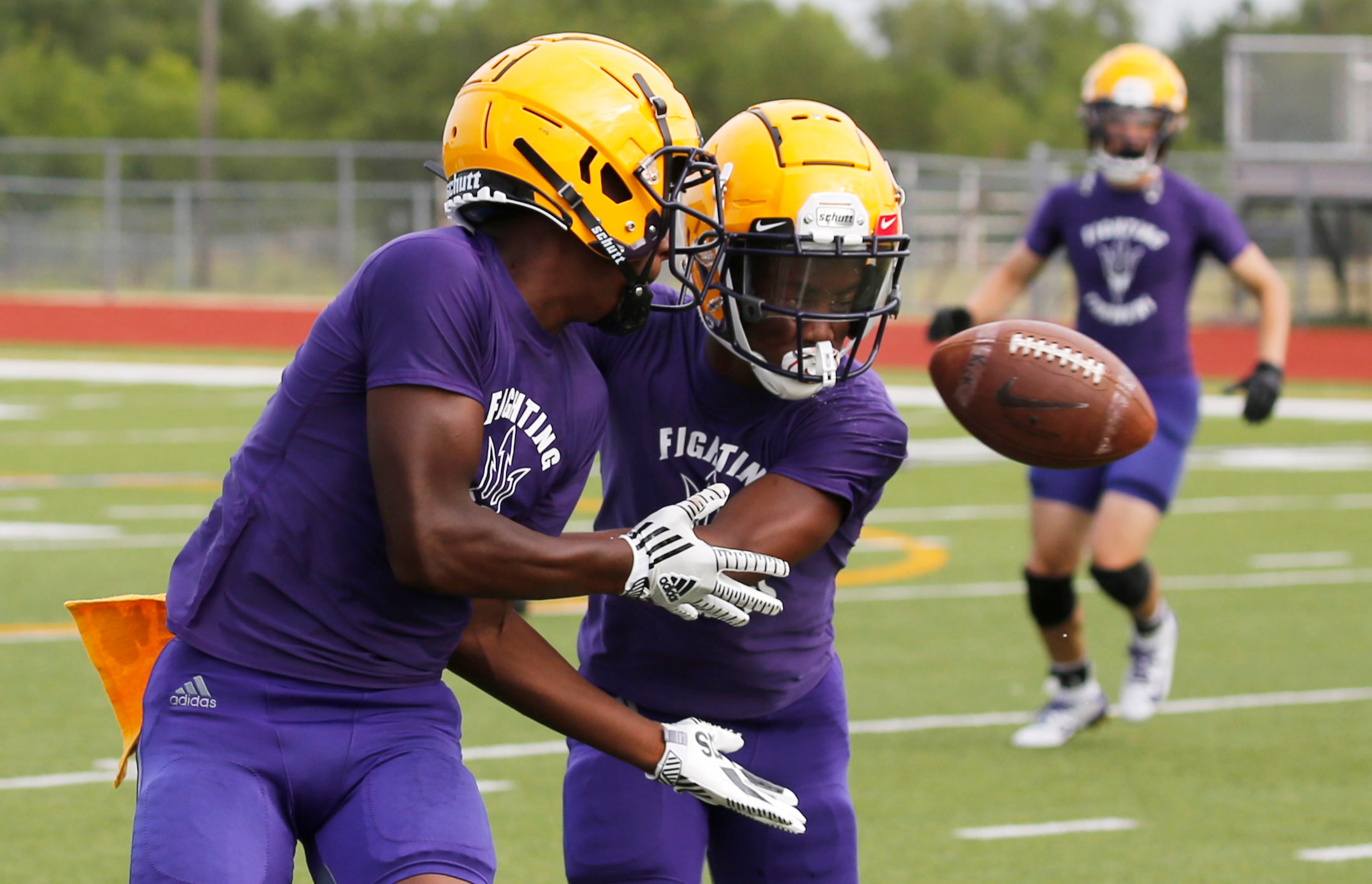 Farmersville's Jeralin Craddock (right) breaks up a pass intended for Farmersville's Noah...