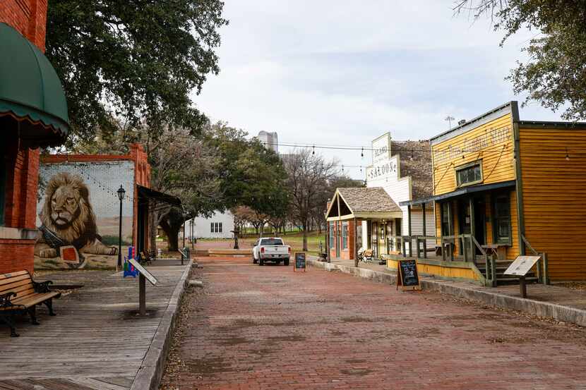 Old City Park's Main Street includes the yellow and green Blum Bros. General Store and...
