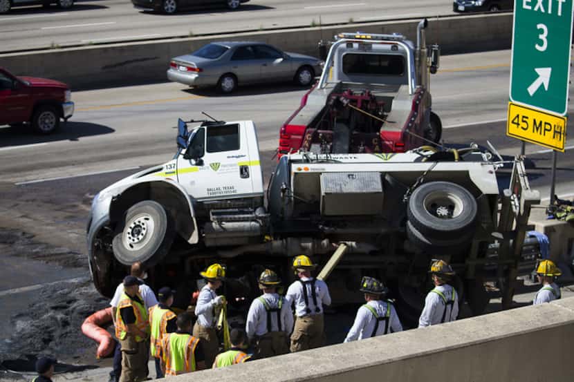 Emergency personnel worked the scene of a truck crash near Mockingbird Lane and northbound...