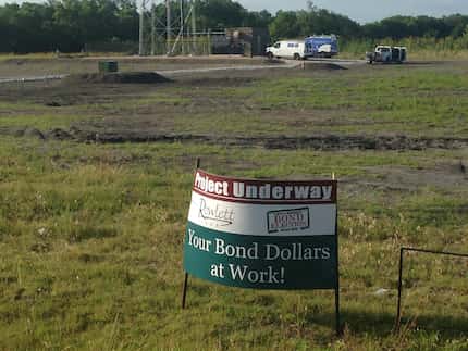 When seeing a parks department employee placing a bond project sign at the tower site in...