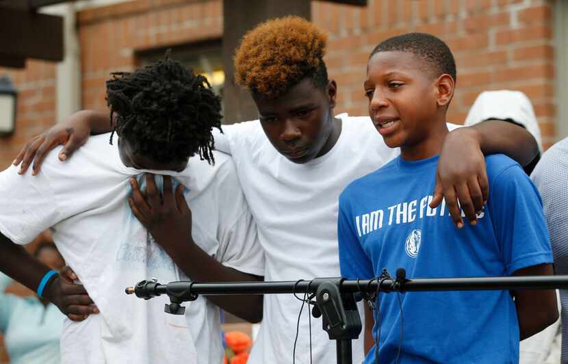 MaQuesta Martin Jr., right, gets emotional as he talks about his friend Malik Tyler during a...