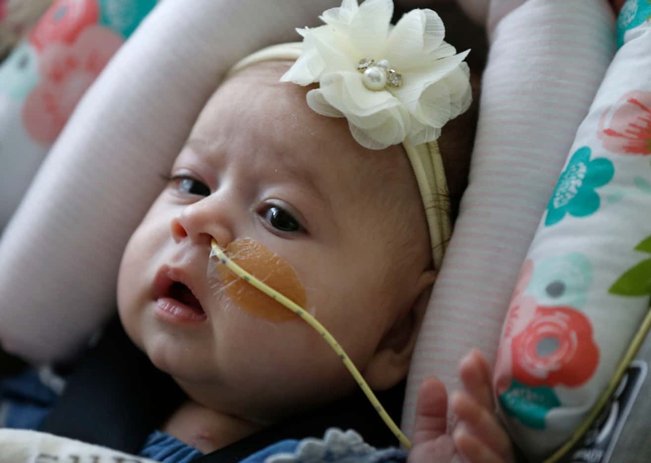 Olivia Solis sat in a car seat at Children's Medical Center in Dallas on Tuesday, June 19,...