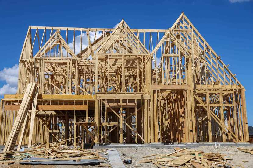 Builders took out more than 27% fewer home construction permits in December.  (Lola...
