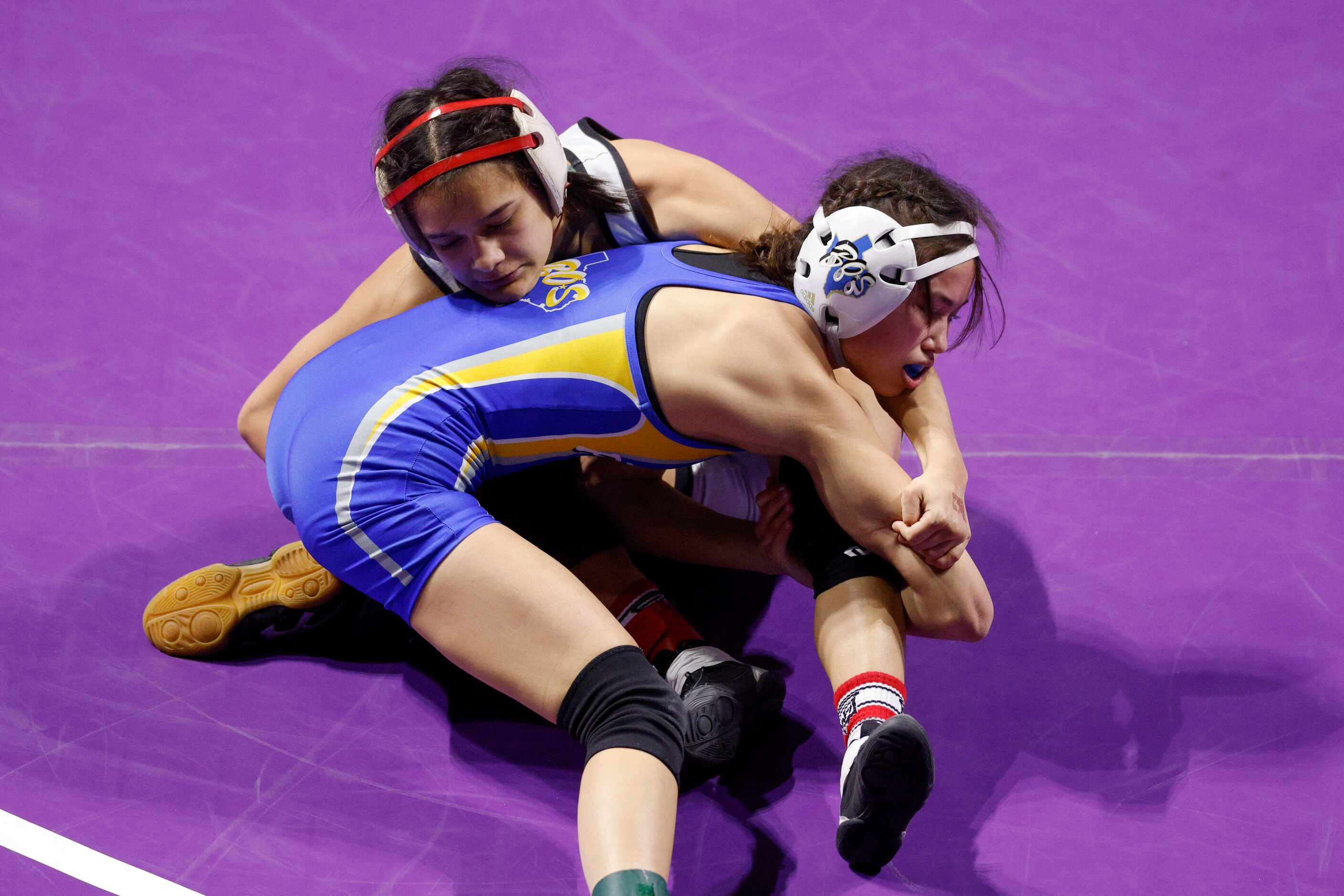 Sloan Stewart of Rockwall Heath (left) wrestles Alana Lee of Fort Worth Boswell during the...