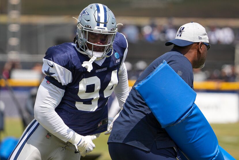 Dallas Cowboys defensive end Randy Gregory (94) runs a drill during a practice at training...