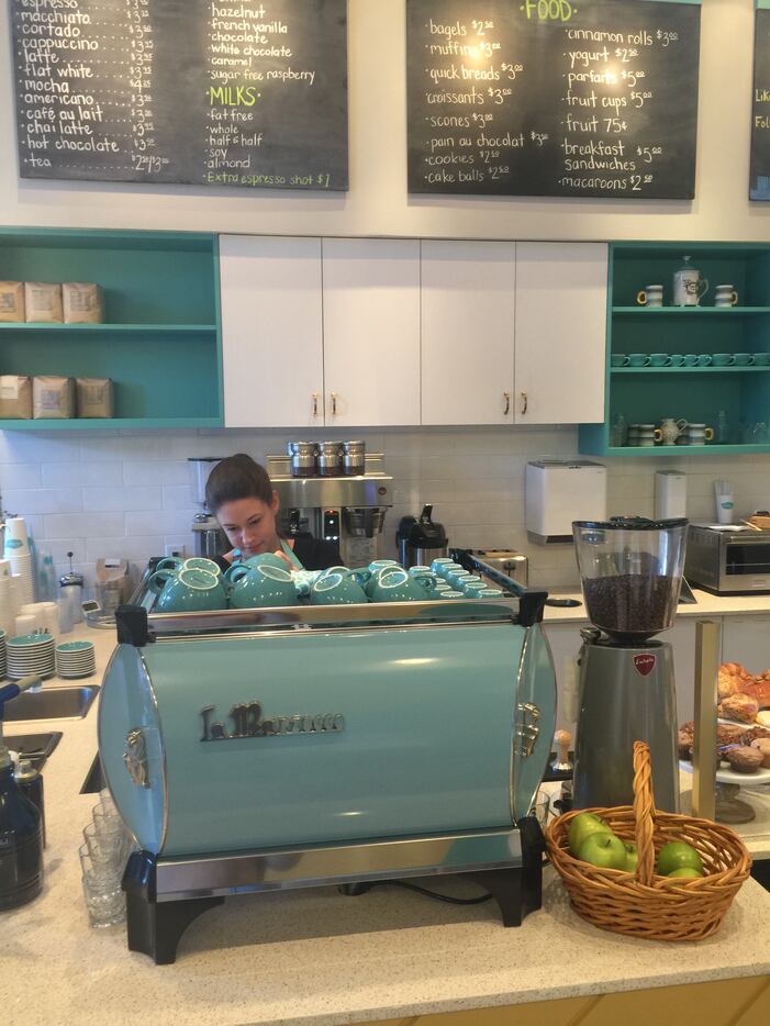 The blue La Marzocco machine sits forefront as a reminder that coffee is the center of the...