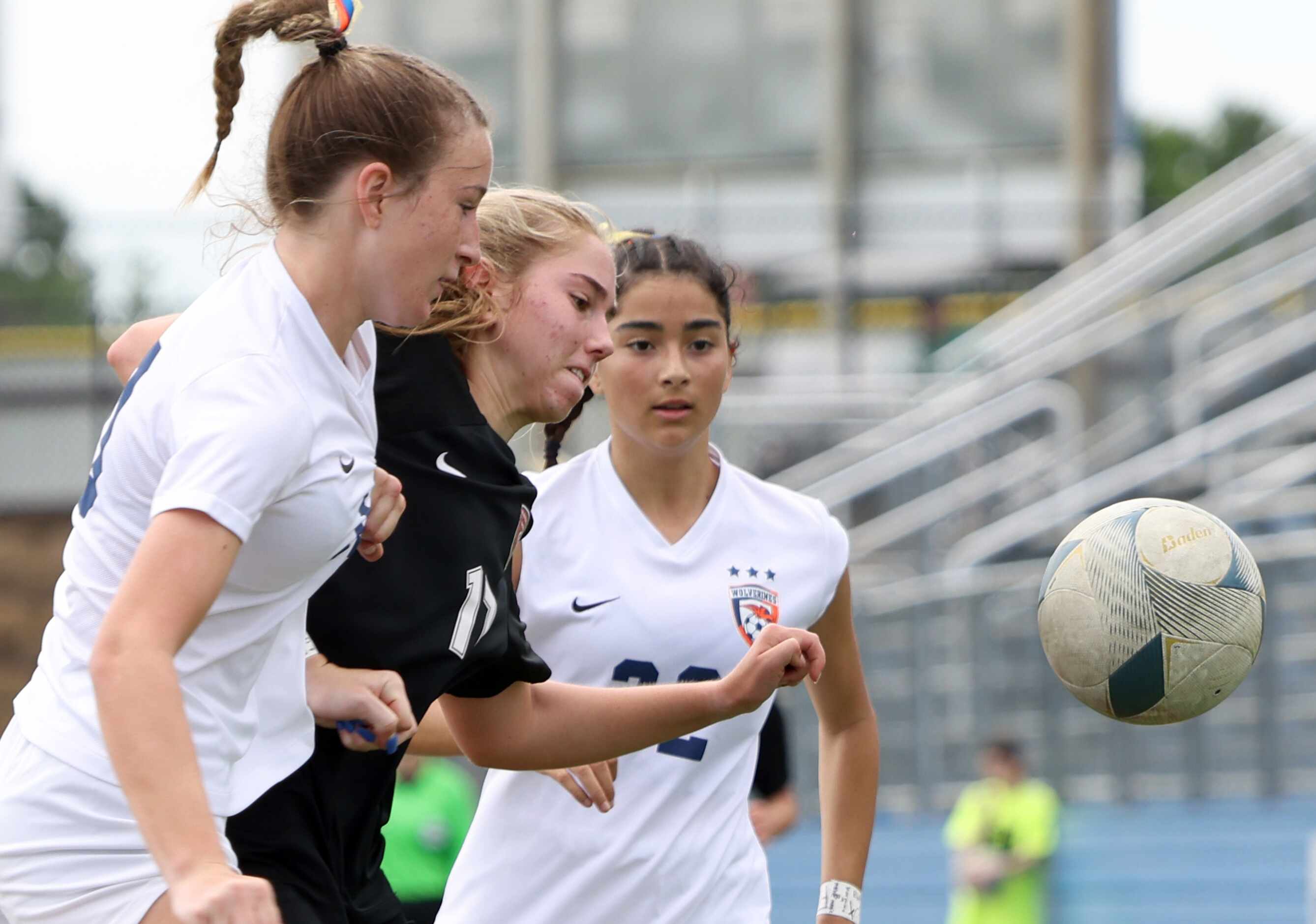 Colleyville Heritage forward Allie Love (17), center, is framed by Frisco Wakeland's Anna...